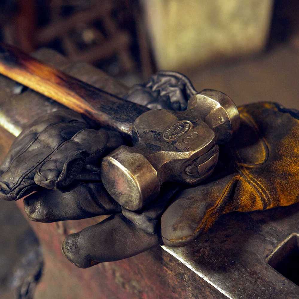 A blacksmith at the anvil. Photograph by Andy Gallacher Photography.